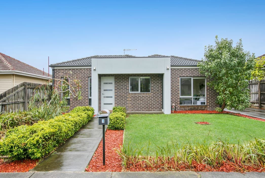 Single-storey brick house with front garden