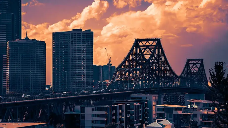 Skyline of Brisbane with Story Bridge at sunset, illustrating the city’s appeal as a prime property investment opportunity.