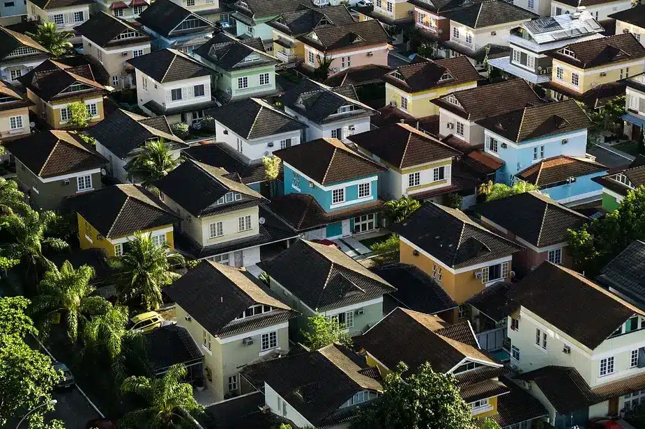 Aerial view of colorful houses in an Australian neighborhood, illustrating long-term housing market trends.