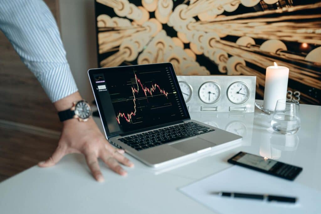 Property investment market analysis on laptop showing financial chart representing negative gearing and tax policy impact on Australian property investors